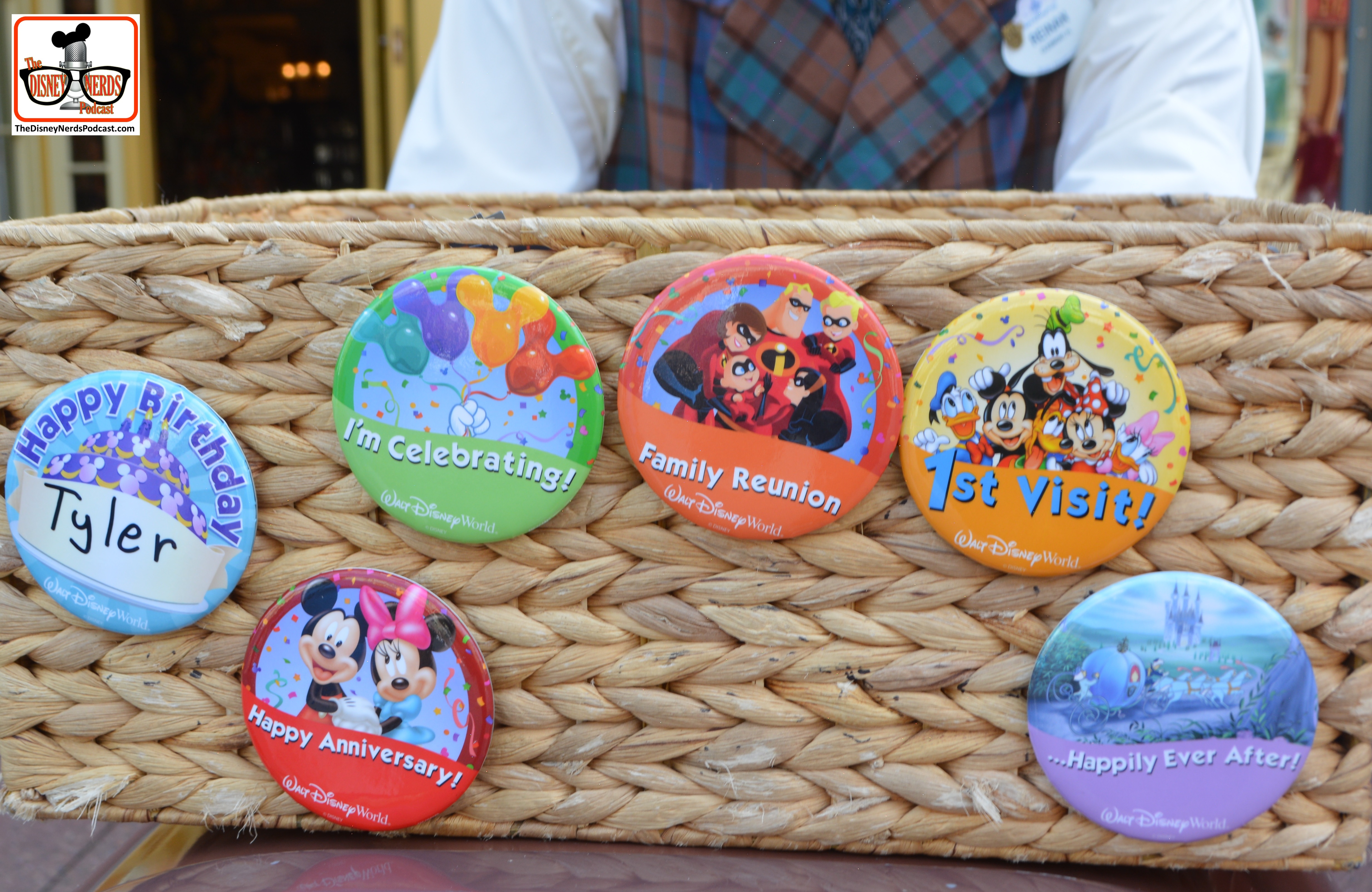 Cast Members with celebration buttons on main street.