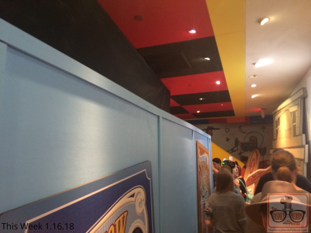 News flash from Pixar Place! The main que room of Toy Story Midway Mania is now behind construction walls. Attraction riders now enter both stand by and fastpass ques outside but then gradually merge together through the emergency exit. Grab those yellow 3-D glasses and rack up some points on this attraction.