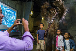 Guests can encounter Chewbacca in his makeshift Rebel Base at Star Wars Launch Bay in at Disney's Hollywood Studios Inside Star Wars Launch Bay, guests also may play the latest Star Wars interactive video games, explore galleries full of treasured memorabilia and authentic replicas of large-scale Star Wars artifacts, including those from Star Wars: The Force Awakens, and purchase Star Wars merchandise. DisneyÕs Hollywood Studios is one of four theme parks at Walt Disney World Resort located in Lake Buena Vista, Fla. (Matt Stroshane, photographer)
